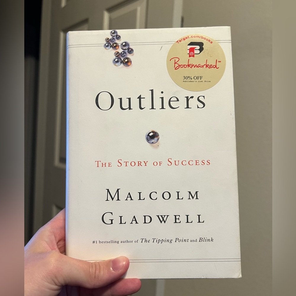 Outliers by Malcolm Gladwell - hard cover book